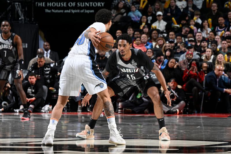 BROOKLYN, NY - DECEMBER 1: Keon Johnson #45 of the Brooklyn Nets plays defense during the game against the Orlando Magic on December 1, 2024 at Barclays Center in Brooklyn, New York. NOTE TO USER: User expressly acknowledges and agrees that, by downloading and or using this Photograph, user is consenting to the terms and conditions of the Getty Images License Agreement. Mandatory Copyright Notice: Copyright 2024 NBAE (Photo by David Dow/NBAE via Getty Images)