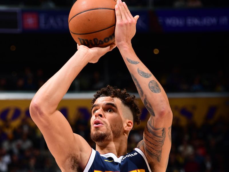 LOS ANGELES, CA - NOVEMBER 23: Michael Porter Jr. #1 of the Denver Nuggets shoots a free throw during the game against the Los Angeles Lakers on November 23, 2024 at Crypto.Com Arena in Los Angeles, California. NOTE TO USER: User expressly acknowledges and agrees that, by downloading and/or using this Photograph, user is consenting to the terms and conditions of the Getty Images License Agreement. Mandatory Copyright Notice: Copyright 2024 NBAE (Photo by Adam Pantozzi/NBAE via Getty Images)