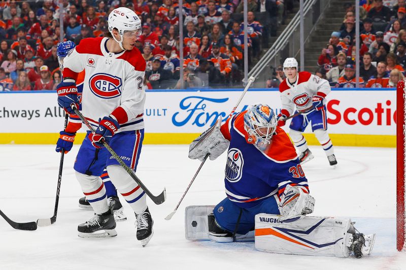 Mar 19, 2024; Edmonton, Alberta, CAN; Edmonton Oilers goaltender Calvin Pickard (30) makes a save on  on a deflection by Montreal Canadiens forward Juraj Slafkovsky (20) during the second period at Rogers Place. Mandatory Credit: Perry Nelson-USA TODAY Sports