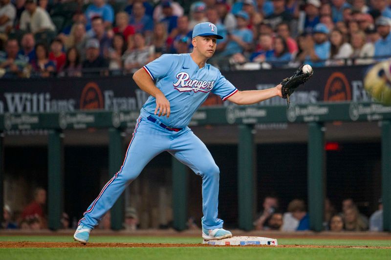 Sep 24, 2023; Arlington, Texas, USA; Texas Rangers first baseman Nathaniel Lowe (30) puts out Seattle Mariners first baseman Ty France (23) at first base during the game at Globe Life Field. Mandatory Credit: Jerome Miron-USA TODAY Sports