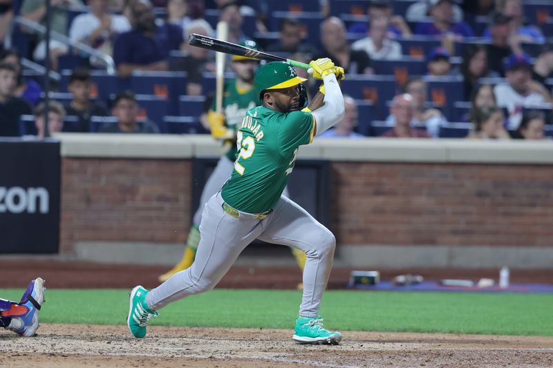 Aug 13, 2024; New York City, New York, USA; Oakland Athletics left fielder Miguel Andujar (22) follows through on an RBI single against the New York Mets during the sixth inning at Citi Field. Mandatory Credit: Brad Penner-USA TODAY Sports