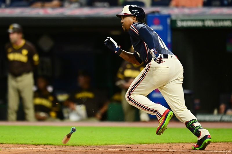 Jul 19, 2024; Cleveland, Ohio, USA; Cleveland Guardians third baseman Jose Ramirez (11) hits an RBI single during the eighth inning against the San Diego Padres at Progressive Field. Mandatory Credit: Ken Blaze-USA TODAY Sports