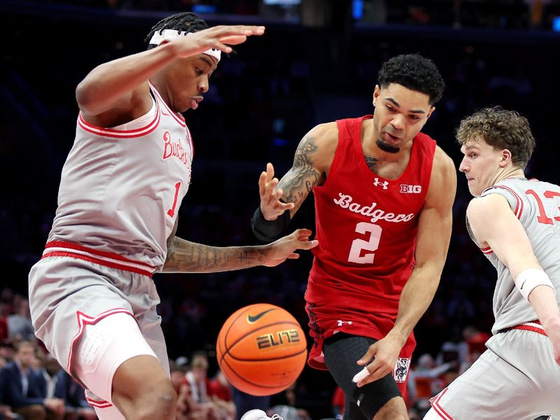 Feb 17, 2026; Columbus, Ohio, USA; Wisconsin Badgers guard Nick Boyd (2) loses the ball as Ohio State Buckeyes forward Amare Bynum (1) defends during the first half at Value City Arena. Mandatory Credit: Joseph Maiorana-Imagn Images