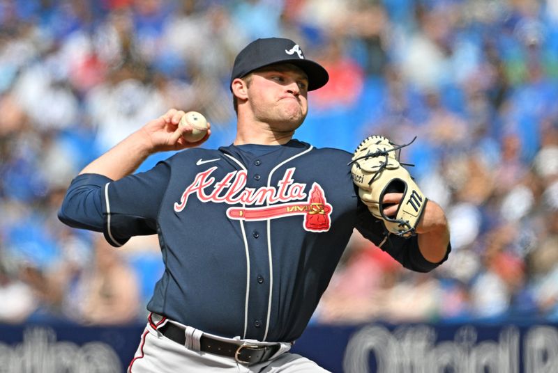 May 13, 2023; Toronto, Ontario, CAN; Atlanta Braves starting pitcher Bryce Elder (55) delivers a pitch against the Toronto Blue Jays in the first inning at Rogers Centre. Mandatory Credit: Dan Hamilton-USA TODAY Sports