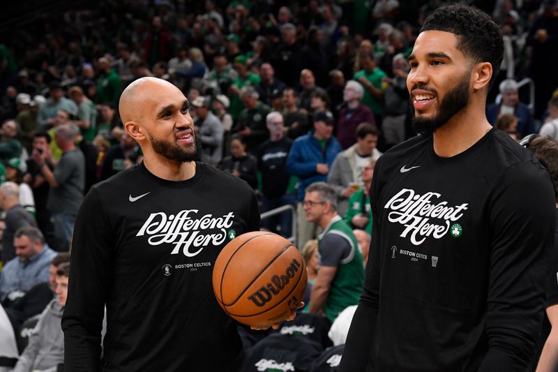 BOSTON, MA - APRIL 21: Derrick White #9 and Jayson Tatum #0 of the Boston Celtics talk before the game against the Miami Heat during Round 1 Game 1 of the 2024 NBA Playoffs on April 21, 2024 at the TD Garden in Boston, Massachusetts. NOTE TO USER: User expressly acknowledges and agrees that, by downloading and or using this photograph, User is consenting to the terms and conditions of the Getty Images License Agreement. Mandatory Copyright Notice: Copyright 2024 NBAE  (Photo by Brian Babineau/NBAE via Getty Images)