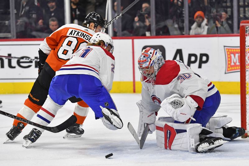 Jan 10, 2024; Philadelphia, Pennsylvania, USA; Montreal Canadiens goaltender Cayden Primeau (30) makes a save as defenseman Kaiden Guhle (21) clears Philadelphia Flyers right wing Cam Atkinson (89) during third period at Wells Fargo Center. Mandatory Credit: Eric Hartline-USA TODAY Sports