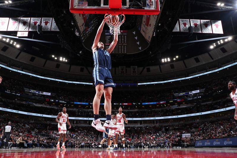 CHICAGO, IL - OCTOBER 12: Zach Edey #14 of the Memphis Grizzlies dunks the ball during the game against the Chicago Bulls during a NBA preseason game on October 12, 2024 at United Center in Chicago, Illinois. NOTE TO USER: User expressly acknowledges and agrees that, by downloading and or using this photograph, User is consenting to the terms and conditions of the Getty Images License Agreement. Mandatory Copyright Notice: Copyright 2024 NBAE (Photo by Jeff Haynes/NBAE via Getty Images)