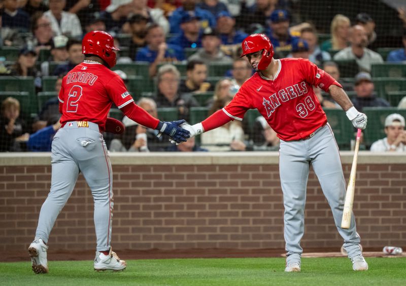 Sep 12, 2025; Seattle, Washington, USA; Los Angeles Angels second baseman Luis Rengifo (2) is congratulated by catcher Sebastián Rivero (38) during the seventh inning against the Seattle Mariners at T-Mobile Park. Mandatory Credit: Stephen Brashear-Imagn Images