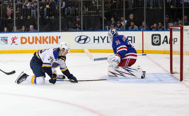 Nov 25, 2024; New York, New York, USA; New York Rangers goalie Igor Shesterkin (31) makes a save on St. Louis Blues center Zack Bolduc (76) during the third period at Madison Square Garden. Mandatory Credit: Danny Wild-Imagn Images