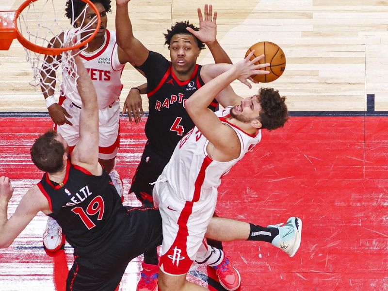 TORONTO, CANADA - FEBRUARY 9: Alperen Sengun #28 of the Houston Rockets drives to the basket during the game against the Toronto Raptors on February 9, 2024 at the Scotiabank Arena in Toronto, Ontario, Canada.  NOTE TO USER: User expressly acknowledges and agrees that, by downloading and or using this Photograph, user is consenting to the terms and conditions of the Getty Images License Agreement.  Mandatory Copyright Notice: Copyright 2024 NBAE (Photo by Vaughn Ridley/NBAE via Getty Images)