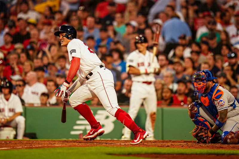 Jul 23, 2023; Boston, Massachusetts, USA; Boston Red Sox shortstop Yu Chang (20) singles to left to drive in a run against the New York Mets in the third inning at Fenway Park. Mandatory Credit: David Butler II-USA TODAY Sports