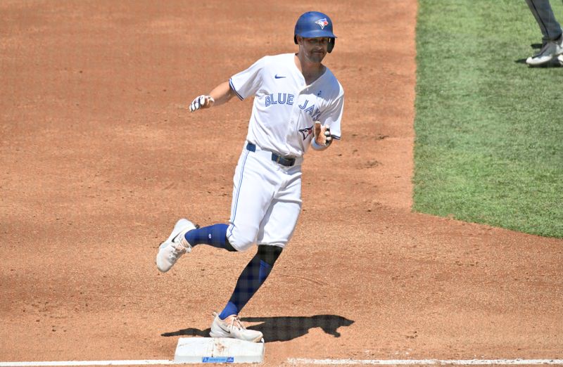 Jun 16, 2024; Toronto, Ontario, CAN;  Toronto Blue Jays third baseman Ernie Clement (28) rounds the bases after hitting a two run home run against the Cleveland Guardians in the second inning at Rogers Centre. Mandatory Credit: Dan Hamilton-USA TODAY Sports