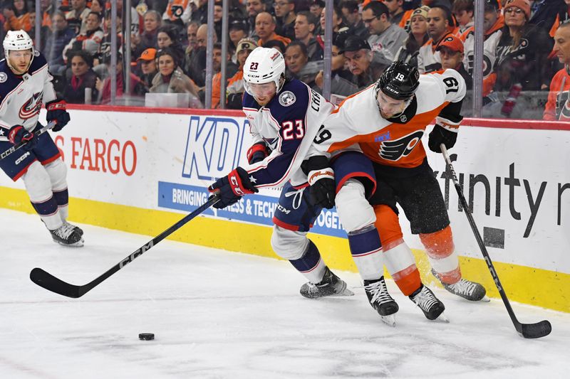 Jan 4, 2024; Philadelphia, Pennsylvania, USA; Columbus Blue Jackets defenseman Jake Christiansen (23) and Philadelphia Flyers right wing Garnet Hathaway (19) battle for the puck during the first period at Wells Fargo Center. Mandatory Credit: Eric Hartline-USA TODAY Sports