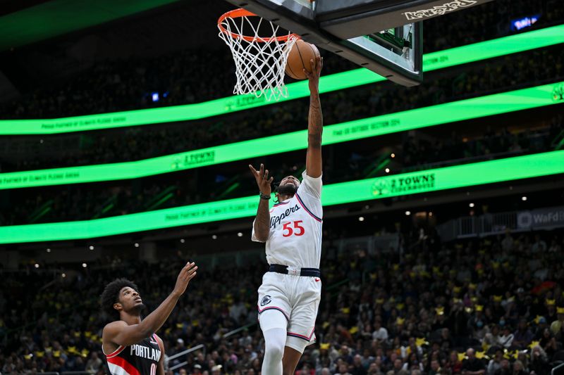 SEATTLE, WASHINGTON - OCTOBER 11: Derrick Jones Jr. #55 of the LA Clippers shoots the ball during the first quarter of the Rain City Showcase game against the Portland Trail Blazers at Climate Pledge Arena on October 11, 2024 in Seattle, Washington. The LA Clippers won 101-99. NOTE TO USER: User expressly acknowledges and agrees that, by downloading and or using this photograph, User is consenting to the terms and conditions of the Getty Images License Agreement. (Photo by Alika Jenner/Getty Images)