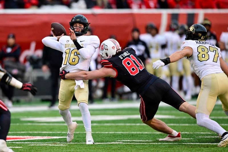 Nov 25, 2023; Salt Lake City, Utah, USA; Colorado Buffaloes quarterback Ryan Staub (16) makes a pass before getting tackled by Utah Utes defensive end Connor O'Toole (81) at Rice-Eccles Stadium. Mandatory Credit: Christopher Creveling-USA TODAY Sports