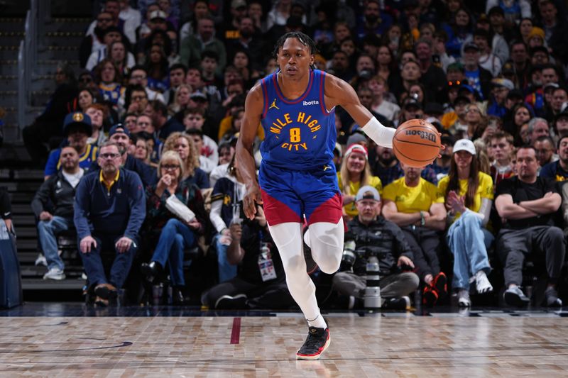 DENVER, CO - MARCH 5: Peyton Watson #8 of the Denver Nuggets dribbles the ball during the game against the Phoenix Suns on March 5, 2024 at the Ball Arena in Denver, Colorado. NOTE TO USER: User expressly acknowledges and agrees that, by downloading and/or using this Photograph, user is consenting to the terms and conditions of the Getty Images License Agreement. Mandatory Copyright Notice: Copyright 2024 NBAE (Photo by Garrett Ellwood/NBAE via Getty Images)