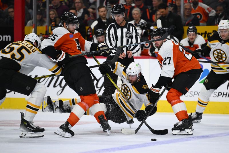 Nov 2, 2024; Philadelphia, Pennsylvania, USA; Boston Bruins center Pavel Zacha (18) falls to the ice against Philadelphia Flyers center Ryan Poehling (25) and left wing Noah Cates (27) in the first period at Wells Fargo Center. Mandatory Credit: Kyle Ross-Imagn Images