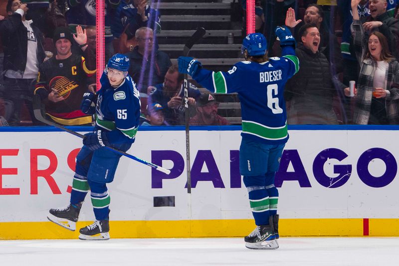 Mar 13, 2024; Vancouver, British Columbia, CAN; Vancouver Canucks forward Brock Boeser (6) and forward Ilya Mikheyev (65) celebrate Mikheyev   s goal scored on forward Elias Pettersson (40) in the first period at Rogers Arena. Mandatory Credit: Bob Frid-USA TODAY Sports