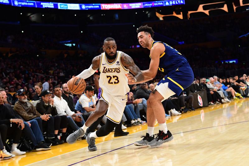 LOS ANGELES, CA - MACH 16: LeBron James #23 of the Los Angeles Lakers dribbles the ball during the game against the Golden State Warriors on March 16, 2024 at Crypto.Com Arena in Los Angeles, California. NOTE TO USER: User expressly acknowledges and agrees that, by downloading and/or using this Photograph, user is consenting to the terms and conditions of the Getty Images License Agreement. Mandatory Copyright Notice: Copyright 2024 NBAE (Photo by Adam Pantozzi/NBAE via Getty Images)