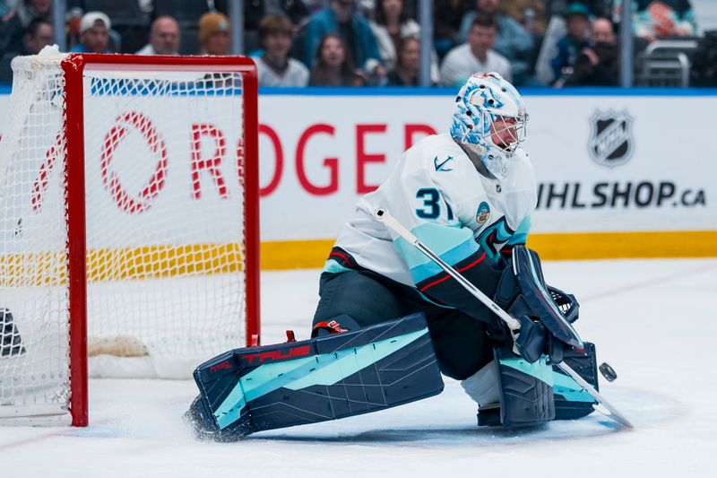 Mar 14, 2026; Vancouver, British Columbia, CAN; Seattle Kraken goalie Philipp Grubauer (31) makes a save against the Vancouver Canucks in the second period at Rogers Arena. Mandatory Credit: Bob Frid-Imagn Images