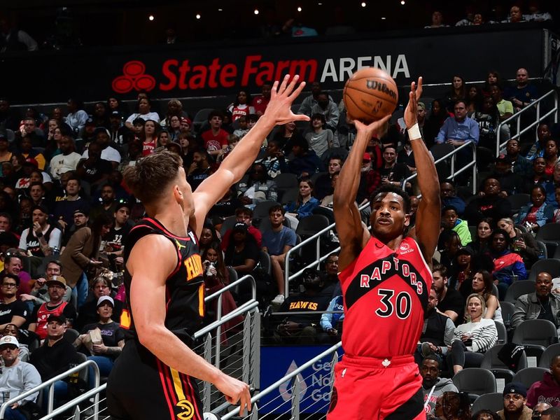 ATLANTA, GA - February 23:   Ochai Agbaji #30 of the Toronto Raptors shoots a three point basket during the game against the Atlanta Hawks on February 23, 2024 at State Farm Arena in Atlanta, Georgia.  NOTE TO USER: User expressly acknowledges and agrees that, by downloading and/or using this Photograph, user is consenting to the terms and conditions of the Getty Images License Agreement. Mandatory Copyright Notice: Copyright 2024 NBAE (Photo by Scott Cunningham/NBAE via Getty Images)