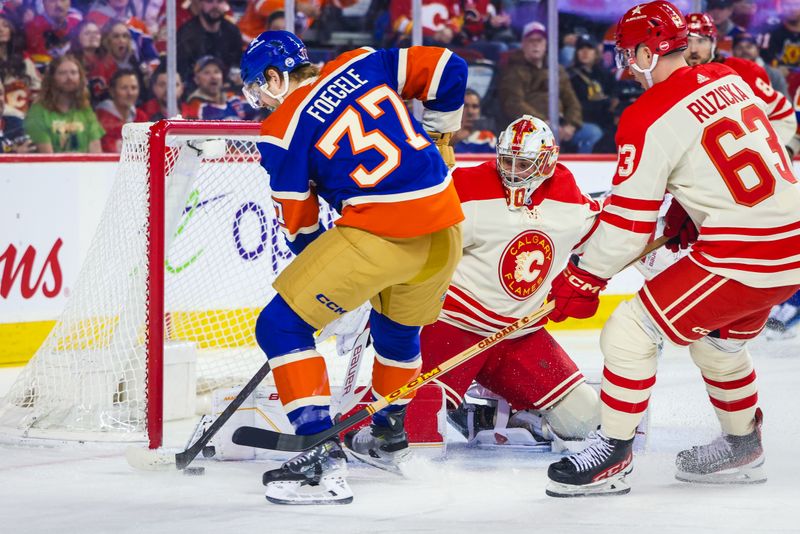 Jan 20, 2024; Calgary, Alberta, CAN; Calgary Flames goaltender Dan Vladar (80) makes a save against Edmonton Oilers left wing Warren Foegele (37) during the first period at Scotiabank Saddledome. Mandatory Credit: Sergei Belski-USA TODAY Sports