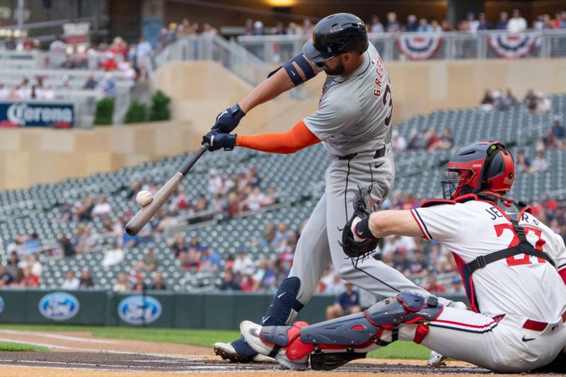 Jul 2, 2024; Minneapolis, Minnesota, USA; Detroit Tigers center fielder Riley Greene (31) connects with the ball in the first inning against the Minnesota Twins at Target Field. Mandatory Credit: Matt Blewett-USA TODAY Sports