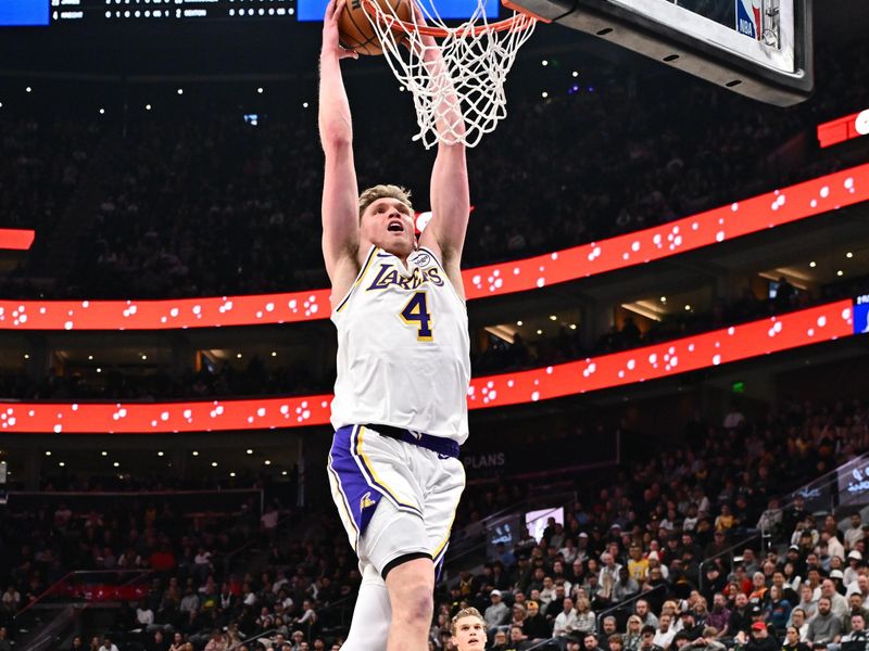 SALT LAKE CITY, UT - DECEMBER 1: Dalton Knecht #4 of the Los Angeles Lakers dunks the ball during the game against the Utah Jazz on December 1, 2024 at Delta Center in Salt Lake City, Utah. NOTE TO USER: User expressly acknowledges and agrees that, by downloading and or using this Photograph, User is consenting to the terms and conditions of the Getty Images License Agreement. Mandatory Copyright Notice: Copyright 2024 NBAE (Photo by Jamie Sabau/NBAE via Getty Images)