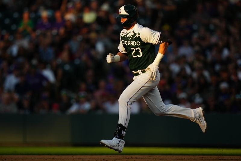 Jul 1, 2023; Denver, Colorado, USA; Colorado Rockies right fielder Kris Bryant (23) heads to second on a throwing error in the third inning against the Detroit Tigers at Coors Field. Mandatory Credit: Ron Chenoy-USA TODAY Sports