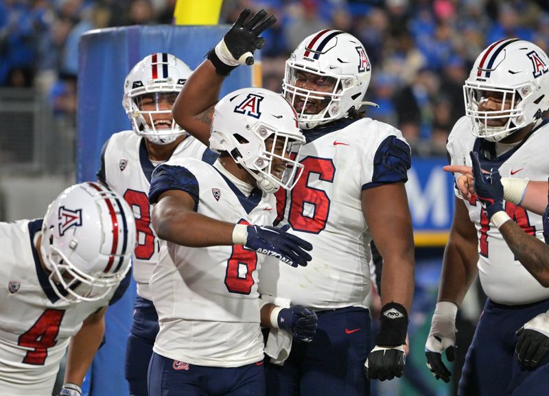 Nov 12, 2022; Pasadena, California, USA;  Arizona Wildcats running back Michael Wiley (6) celebrates in the end zone after a touchdown in the first half against the UCLA Bruins at the Rose Bowl. Mandatory Credit: Jayne Kamin-Oncea-USA TODAY Sports