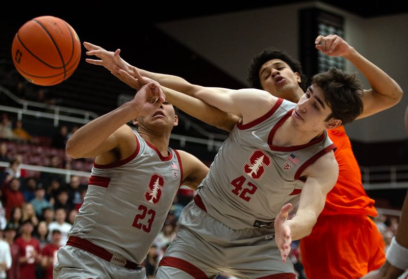 Jan 19, 2023; Stanford, California, USA; Stanford Cardinal forward Maxime Raynaud (42) beats Oregon State Beavers forward Michael Rataj (12) to a rebound during the first half at Maples Pavilion. Mandatory Credit: D. Ross Cameron-USA TODAY Sports