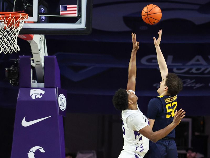 Mar 3, 2026; Manhattan, Kansas, USA; West Virginia Mountaineers guard Tresen Eaglestaff (52) shoots against Kansas State Wildcats forward Taj Manning (15) during the second half at Bramlage Coliseum. Mandatory Credit: Scott Sewell-Imagn Images