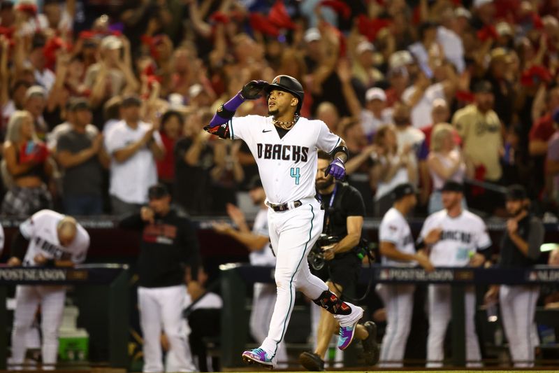 Oct 11, 2023; Phoenix, Arizona, USA; Arizona Diamondbacks second baseman Ketel Marte (4) reacts after hitting a home run against the Los Angeles Dodgers in the third inning for game three of the NLDS for the 2023 MLB playoffs at Chase Field. Mandatory Credit: Mark J. Rebilas-USA TODAY Sports