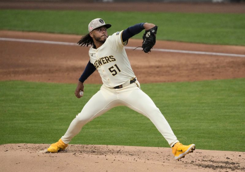 May 18, 2025; Milwaukee, Wisconsin, USA; Milwaukee Brewers pitcher Freddy Peralta (51) delivers a pitch in the third inning against the Minnesota Twins at American Family Field. Mandatory Credit: Michael McLoone-Imagn Images