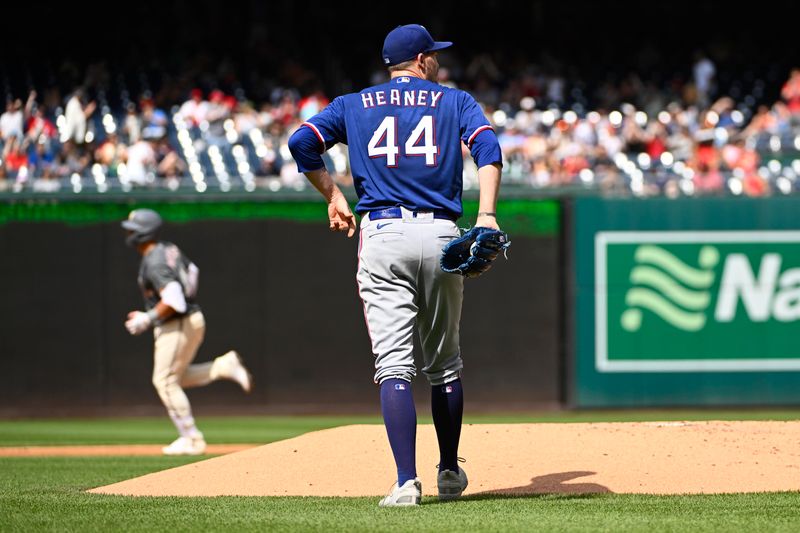 Jul 8, 2023; Washington, District of Columbia, USA; Texas Rangers starting pitcher Andrew Heaney (44) reacts after giving up a solo home run to Washington Nationals first baseman Joey Meneses (45) during the first inning at Nationals Park. Mandatory Credit: Brad Mills-USA TODAY Sports