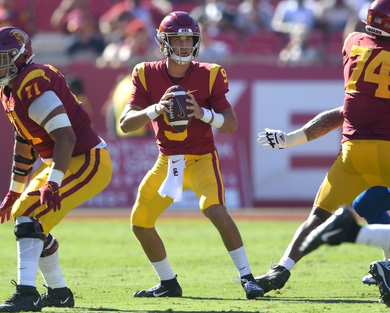 Sep 4, 2021; Los Angeles, California, USA;  USC Trojans quarterback Kedon Slovis (9) sets to pass in the second half of the game against the San Jose State Spartans at United Airlines Field at Los Angeles Memorial Coliseum. Mandatory Credit: Jayne Kamin-Oncea-USA TODAY Sports