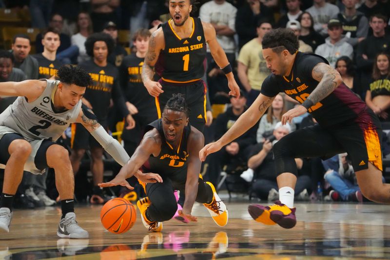 Feb 8, 2024; Boulder, Colorado, USA; Arizona State Sun Devils guard Kamari Lands (0) and guard Jose Perez (12) and Colorado Buffaloes guard KJ Simpson (2) reach for a loose ball in the first half at the CU Events Center. Mandatory Credit: Ron Chenoy-USA TODAY Sports