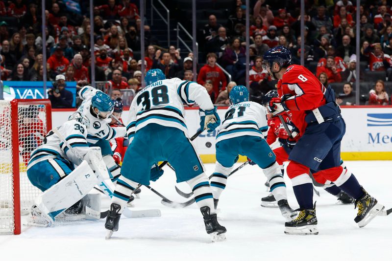 Jan 15, 2026; Washington, District of Columbia, USA; San Jose Sharks and Washington Capitals players battle for the puck in front of Sharks goaltender Alex Nedeljkovic (33) in the final minute during the third period at Capital One Arena. Mandatory Credit: Geoff Burke-Imagn Images