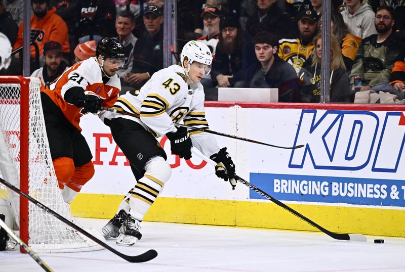 Jan 27, 2024; Philadelphia, Pennsylvania, USA; Boston Bruins center Danton Heinen (43) controls the puck against Philadelphia Flyers center Scott Laughton (21) in the first period at Wells Fargo Center. Mandatory Credit: Kyle Ross-USA TODAY Sports