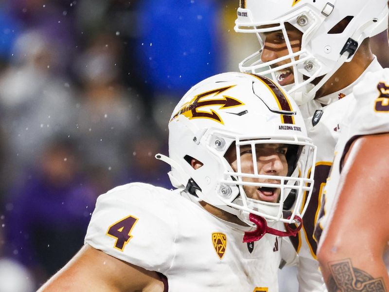 Oct 21, 2023; Seattle, Washington, USA; Arizona State Sun Devils running back Cameron Skattebo (4) celebrates with tight end Messiah Swinson (80) after rushing for a touchdown against the Washington Huskies during the second quarter at Alaska Airlines Field at Husky Stadium. Mandatory Credit: Joe Nicholson-USA TODAY Sports