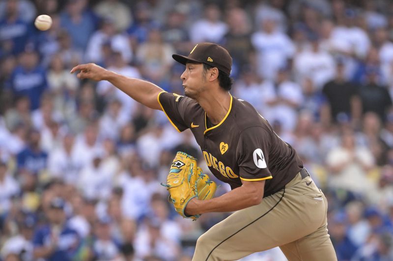 Oct 11, 2024; Los Angeles, California, USA; San Diego Padres pitcher Yu Darvish (11) pitches in the first inning against the Los Angeles Dodgers during game five of the NLDS for the 2024 MLB Playoffs at Dodger Stadium. Mandatory Credit: Jayne Kamin-Oncea-Imagn Images