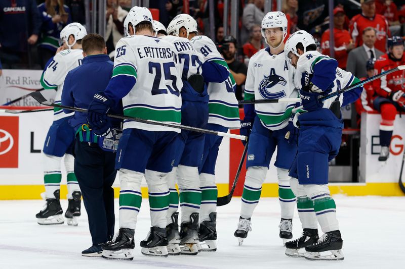 Oct 19, 2025; Washington, District of Columbia, USA; Vancouver Canucks center Filip Chytil (72) is helped off the ice after being injured by a hit from Washington Capitals right wing Tom Wilson (not pictured) during the first period at Capital One Arena. Mandatory Credit: Geoff Burke-Imagn Images