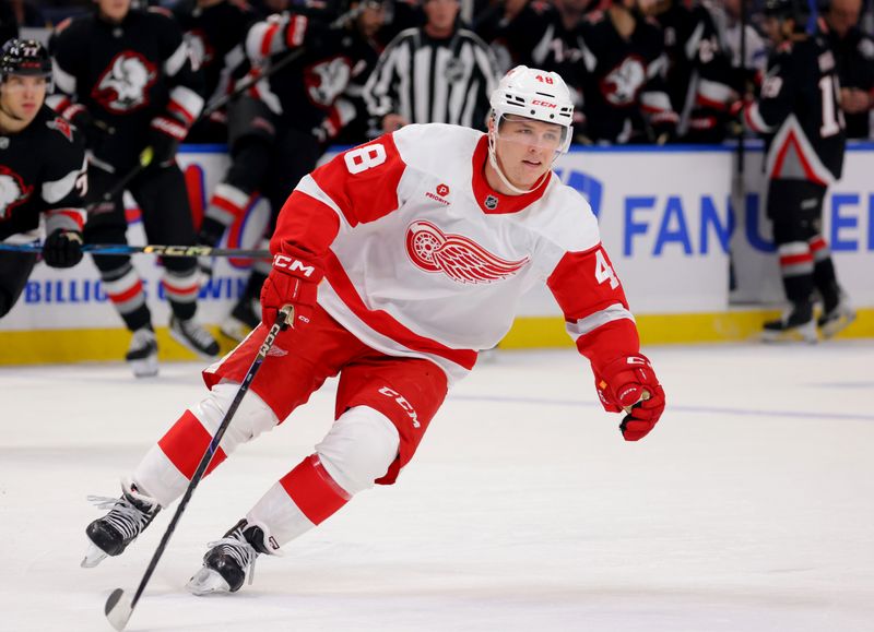 Oct 26, 2024; Buffalo, New York, USA;  Detroit Red Wings right wing Jonatan Berggren (48) skates towards the puck during the first period against the Buffalo Sabres at KeyBank Center. Mandatory Credit: Timothy T. Ludwig-Imagn Images