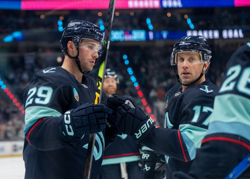 Nov 13, 2025; Seattle, Washington, USA; Seattle Kraken defenseman Vince Dunn (29) is congratulated by forward Jordan Eberle (7) after scoring a goal during the second period against the Winnipeg Jets at Climate Pledge Arena. Mandatory Credit: Stephen Brashear-Imagn Images