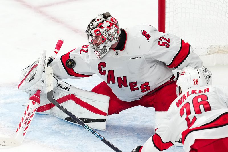 Nov 11, 2024; Las Vegas, Nevada, USA; Carolina Hurricanes goaltender Pyotr Kochetkov (52) makes a save against the Vegas Golden Knights during the third period at T-Mobile Arena. Mandatory Credit: Stephen R. Sylvanie-Imagn Images