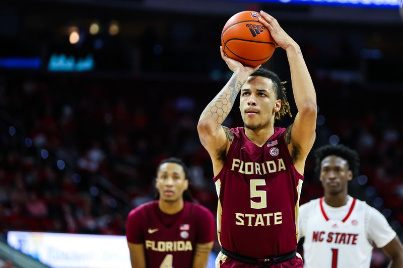 Feb 1, 2023; Raleigh, North Carolina, USA;  Florida State Seminoles forward De'Ante Green (5) shoots a free throw during the second half against North Carolina State Wolfpack at PNC Arena.  Mandatory Credit: Jaylynn Nash-USA TODAY Sports