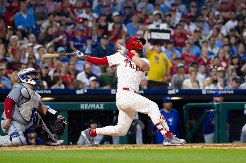 May 7, 2024; Philadelphia, Pennsylvania, USA; Philadelphia Phillies first base Bryce Harper (3) hits a Gand Slam home run during the fourth inning against the Toronto Blue Jays at Citizens Bank Park. Mandatory Credit: Bill Streicher-USA TODAY Sports