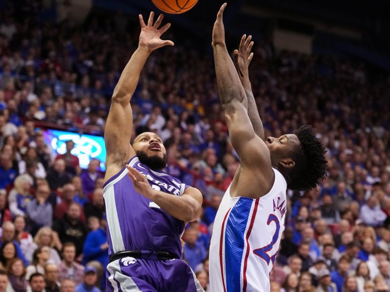 Jan 31, 2023; Lawrence, Kansas, USA; Kansas State Wildcats guard Markquis Nowell (1) shoots against Kansas Jayhawks forward K.J. Adams Jr. (24) during the first half at Allen Fieldhouse. Mandatory Credit: Jay Biggerstaff-USA TODAY Sports