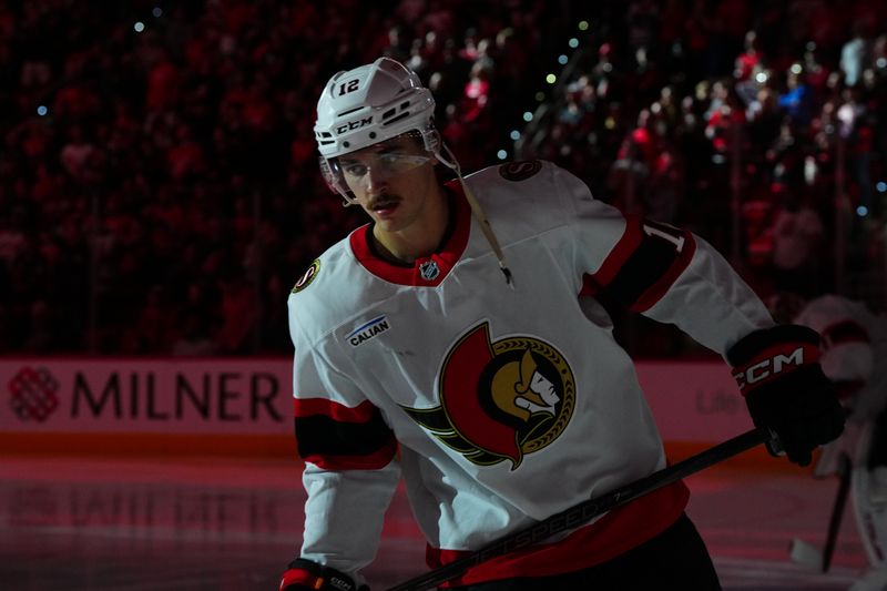 Nov 16, 2024; Raleigh, North Carolina, USA;  Ottawa Senators center Shane Pinto (12) skates before the start of the game against the Carolina Hurricanes at Lenovo Center. Mandatory Credit: James Guillory-Imagn Images