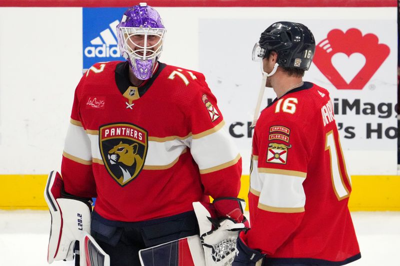 Nov 10, 2023; Sunrise, Florida, USA; Florida Panthers center Aleksander Barkov (16) celebrates with goaltender Sergei Bobrovsky (72) after defeating the Carolina Hurricanes at Amerant Bank Arena. Mandatory Credit: Jasen Vinlove-USA TODAY Sports